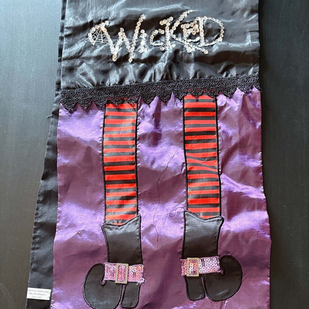 Embroidered 'Wicked' Witch Leg Wall Hanging - Purple & Red table runner.